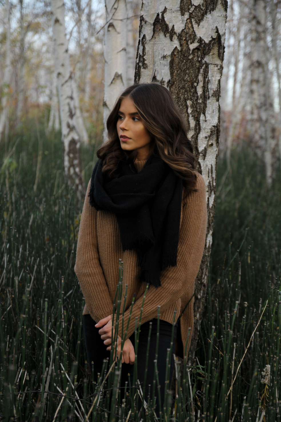 Woman Leaning on Tree